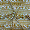 Jersey coton / elasthanne motif style astèque ocre fond crème