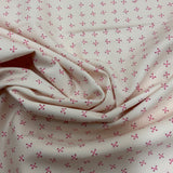 100% coton Os en X fond rose pâle